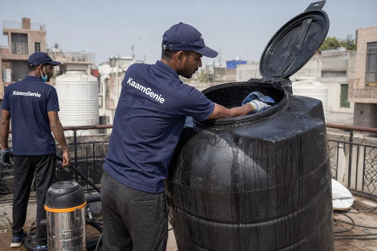 KaamGenie crew cleaning a Sintex / plastic tank in Taimoor Nagar, Delhi
