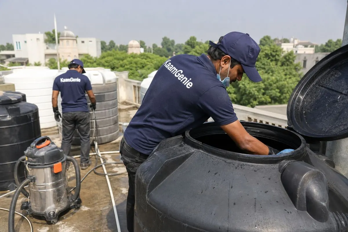 KaamGenie crew cleaning a Sintex / plastic tank in Westend Greens & DLF Farms, Delhi