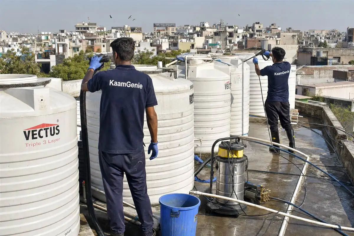 KaamGenie crew cleaning a society water tank in Abul Fazal Enclave, Delhi