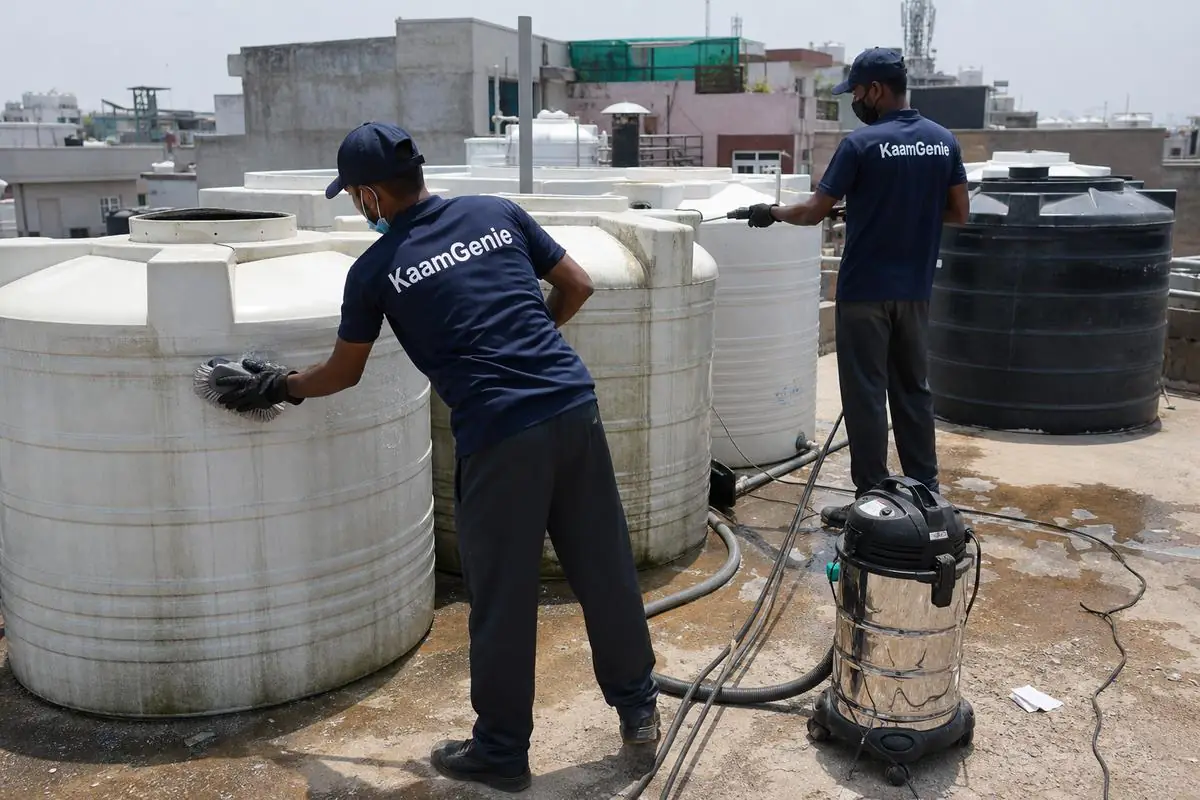 KaamGenie crew cleaning a society water tank in Adarsh Nagar, Delhi