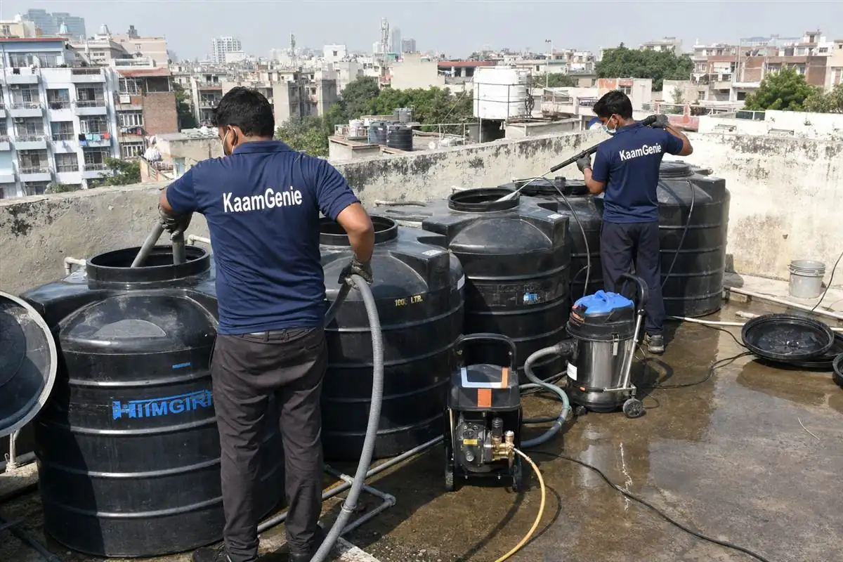 KaamGenie crew cleaning a society water tank in Andrewsganj, Delhi