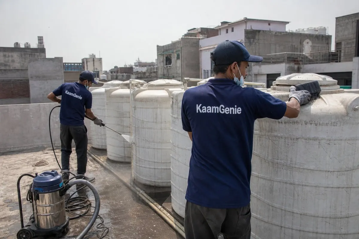 KaamGenie crew cleaning a society water tank in Arjun Nagar, Delhi
