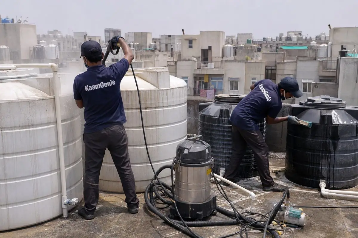 KaamGenie crew cleaning a society water tank in Avantika, Delhi