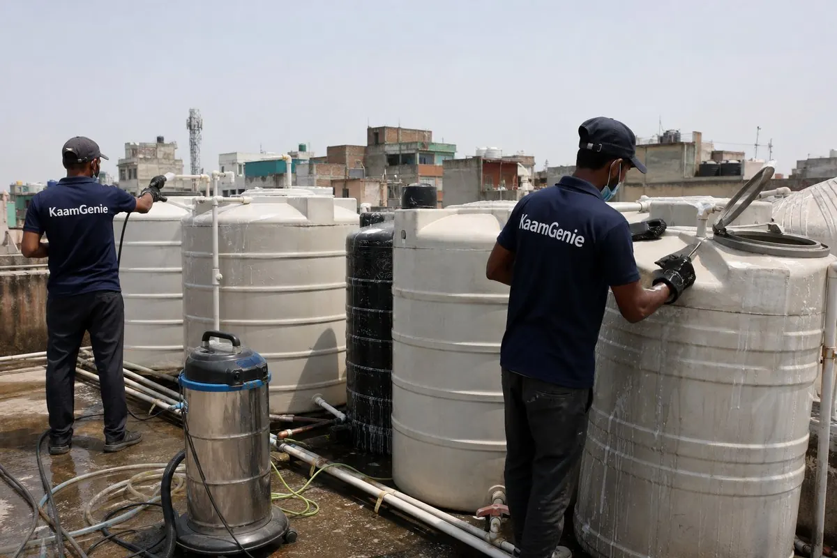 KaamGenie crew cleaning a society water tank in Azadpur, Delhi