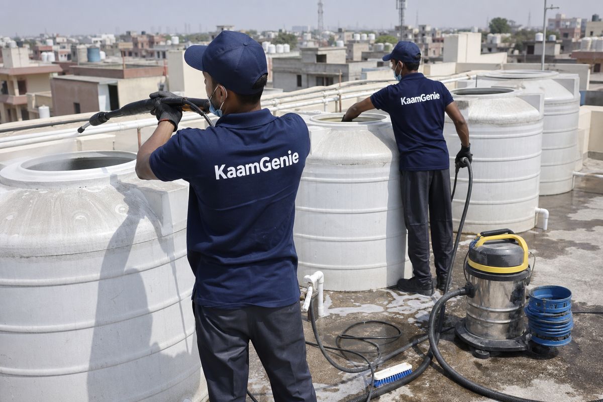 KaamGenie crew cleaning a society water tank in Bakkarwala, Delhi