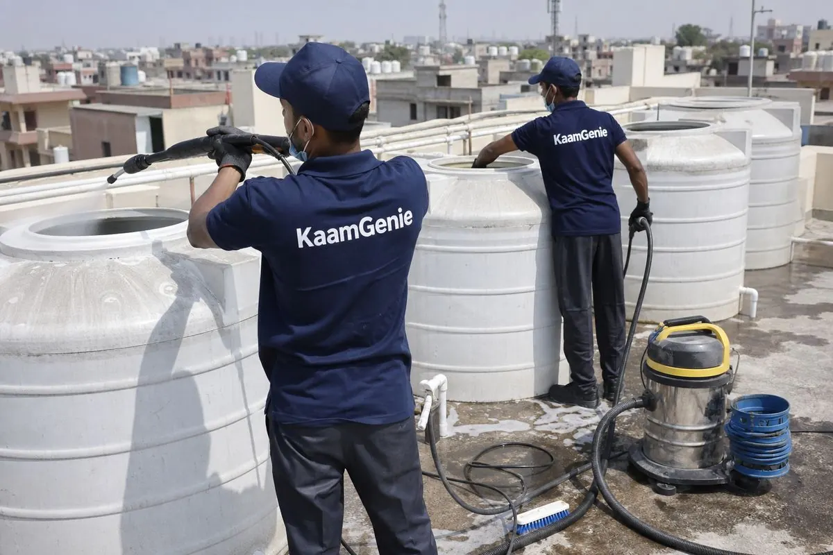 KaamGenie crew cleaning a society water tank in Bakkarwala, Delhi