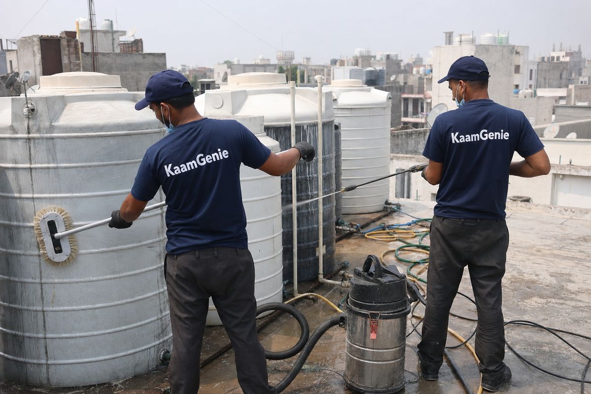 KaamGenie crew cleaning a society water tank in Bijwasan, Delhi