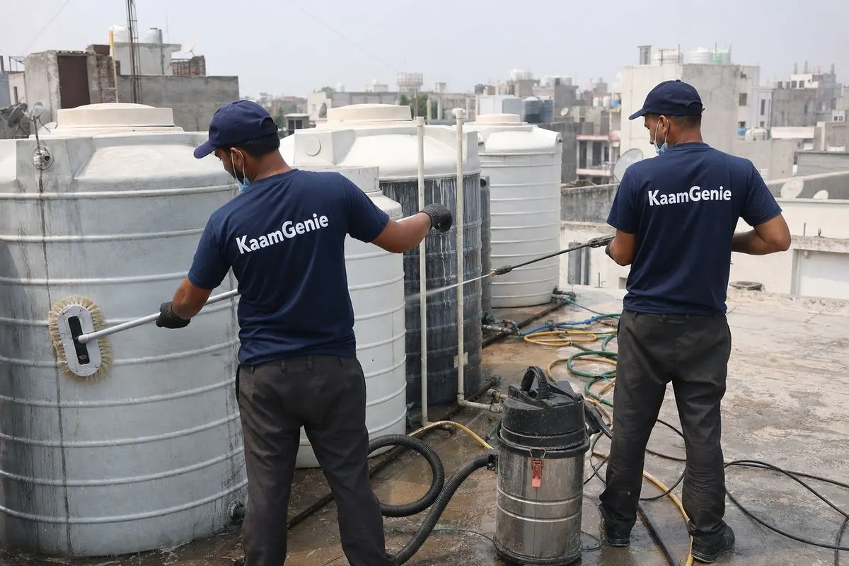 KaamGenie crew cleaning a society water tank in Bijwasan, Delhi