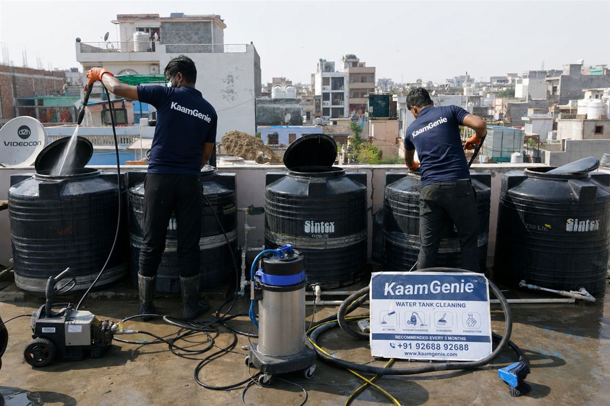 KaamGenie crew cleaning a society water tank in Chirag Delhi, Delhi