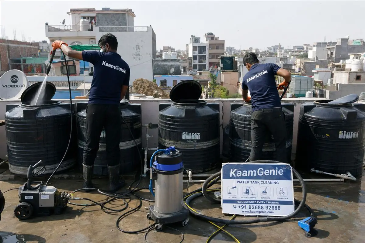 KaamGenie crew cleaning a society water tank in Chirag Delhi, Delhi