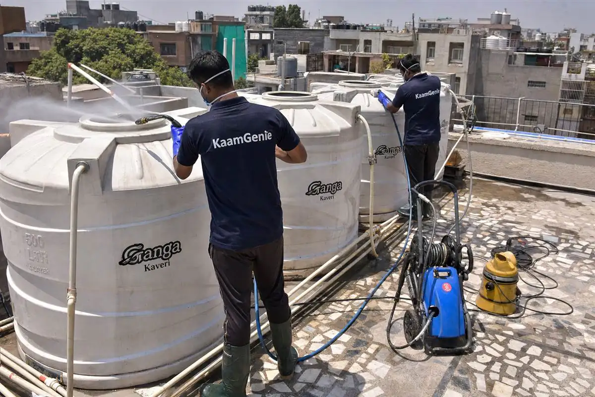 KaamGenie crew cleaning a society water tank in CR Park, Delhi