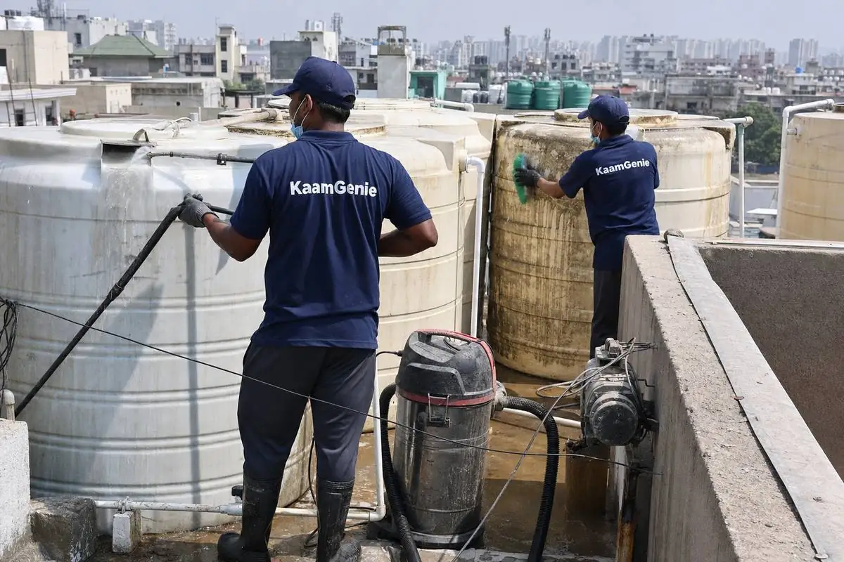 KaamGenie crew cleaning a society water tank in Dwarka Sector 11, Delhi