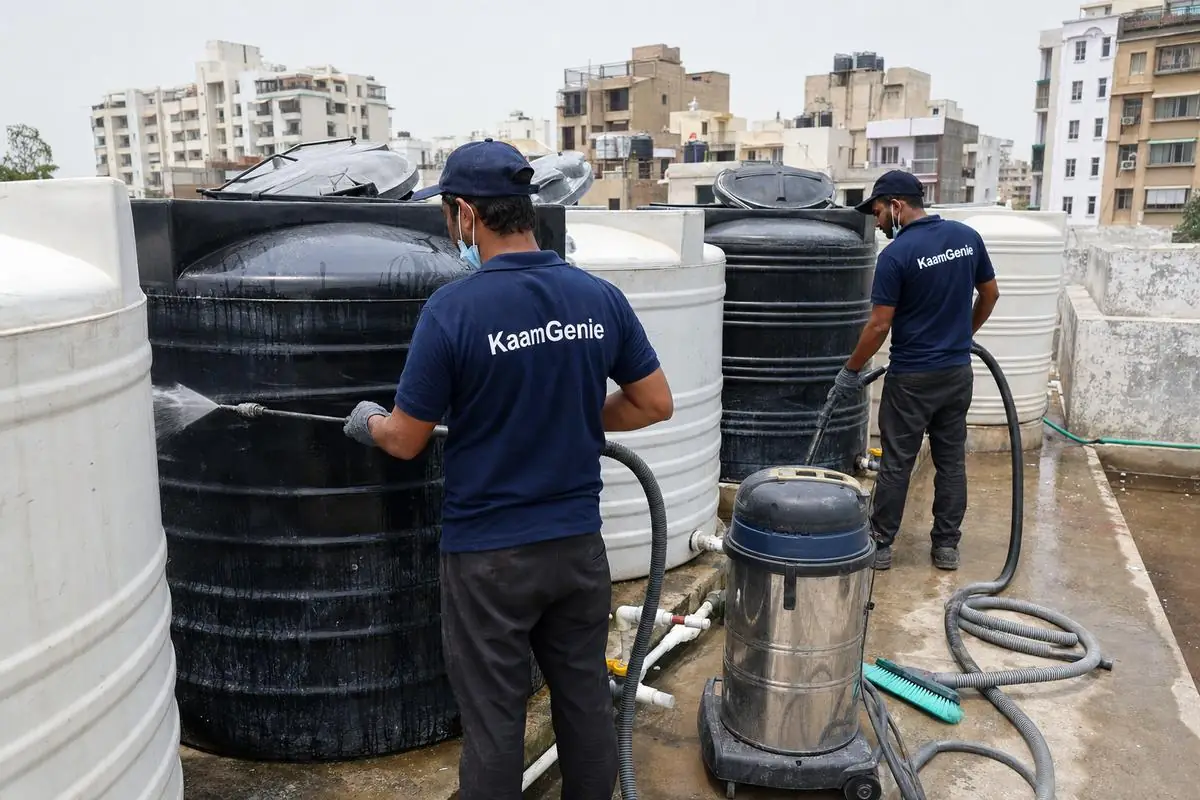 KaamGenie crew cleaning a society water tank in Dwarka Sector 12, Delhi
