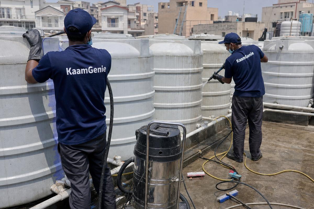 KaamGenie crew cleaning a society water tank in Dwarka Sector 16, Delhi