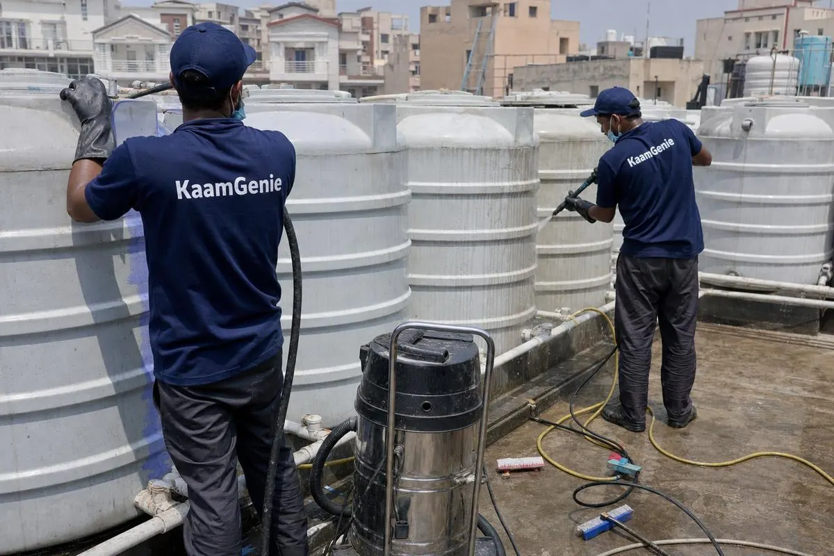 KaamGenie crew cleaning a society water tank in Dwarka Sector 16, Delhi