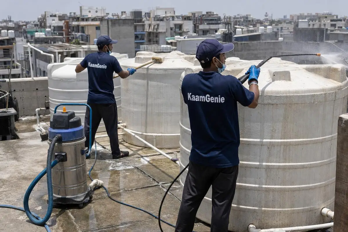 KaamGenie crew cleaning a society water tank in Dwarka Sector 21, Delhi