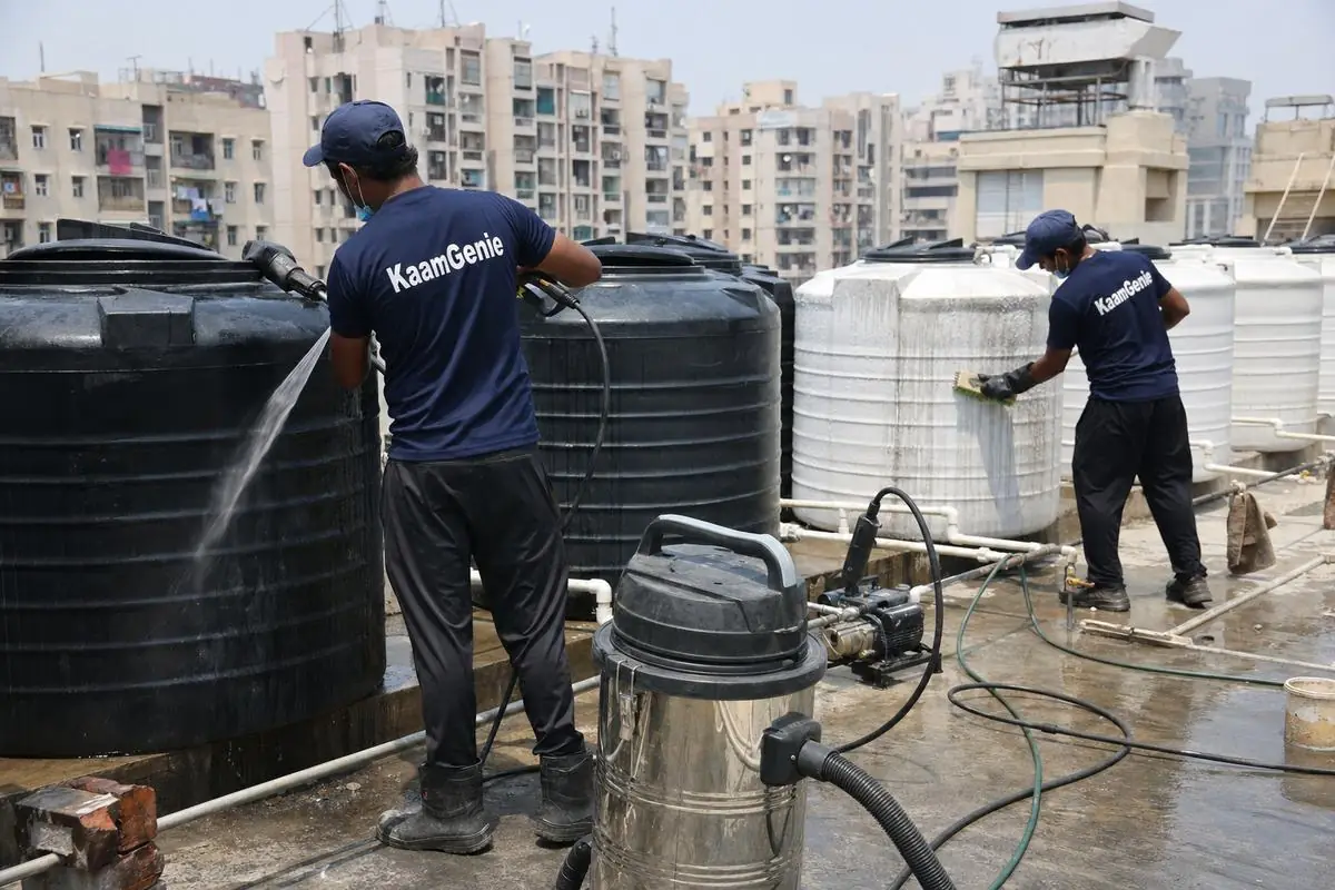 KaamGenie crew cleaning a society water tank in Dwarka Sector 22, Delhi