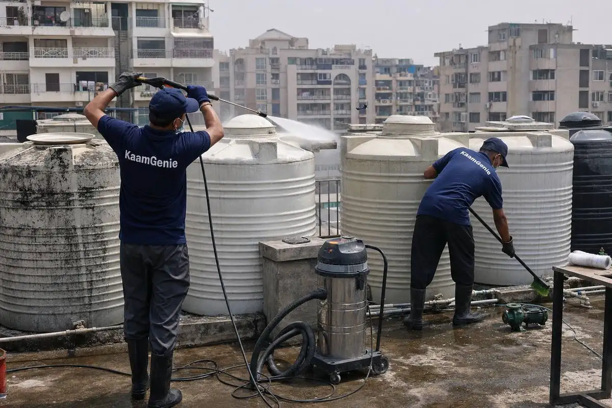 KaamGenie crew cleaning a society water tank in Dwarka Sector 28, Delhi