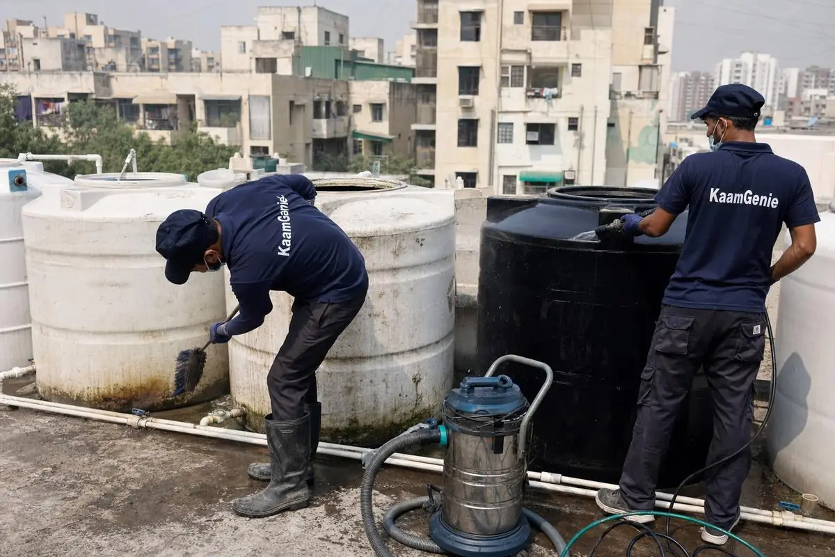 KaamGenie crew cleaning a society water tank in Dwarka Sector 4, Delhi