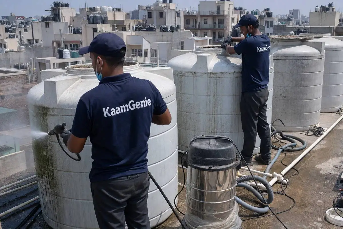 KaamGenie crew cleaning a society water tank in Dwarka Sector 6, Delhi