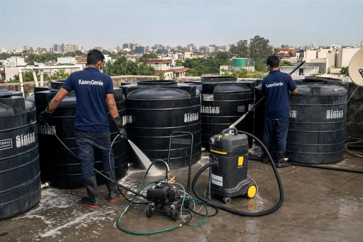 KaamGenie crew cleaning a society water tank in East of Kailash, Delhi