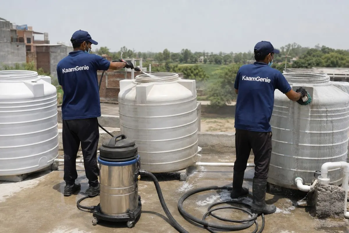 KaamGenie crew cleaning a society water tank in Fatehpur Beri, Delhi