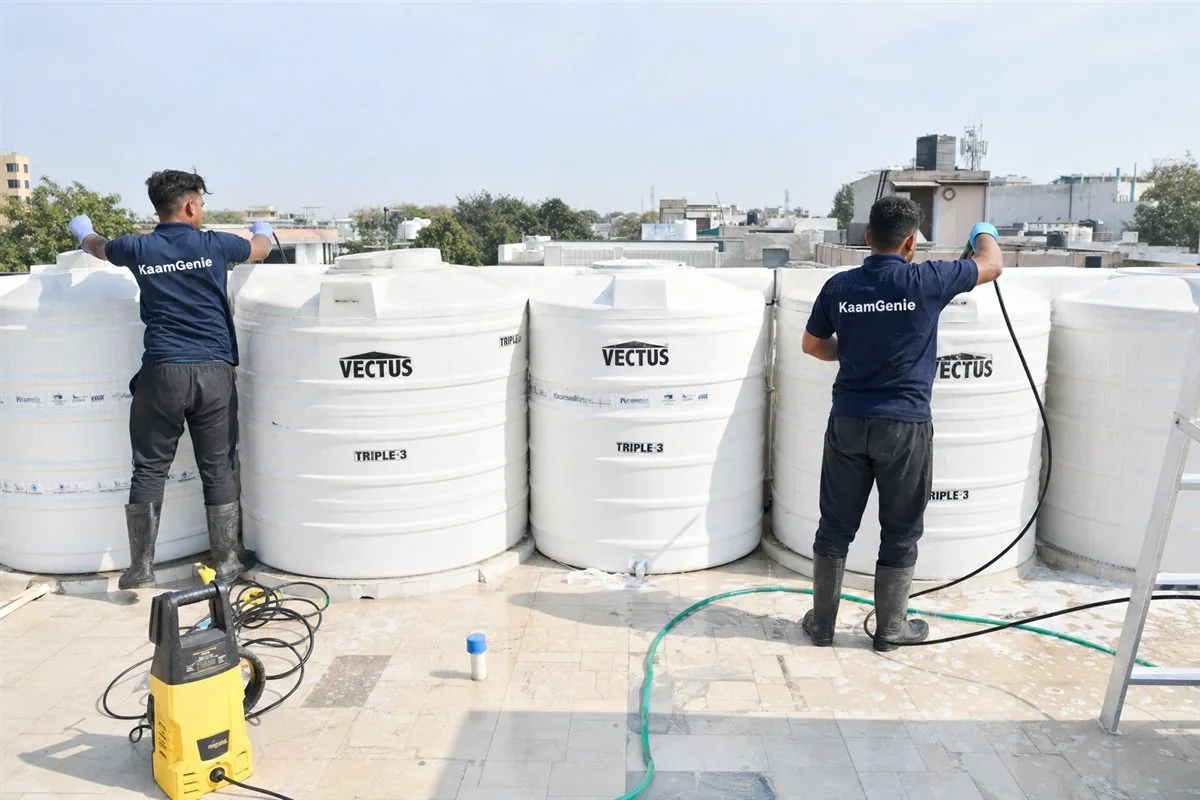 KaamGenie crew cleaning a society water tank in Friends Colony, Delhi
