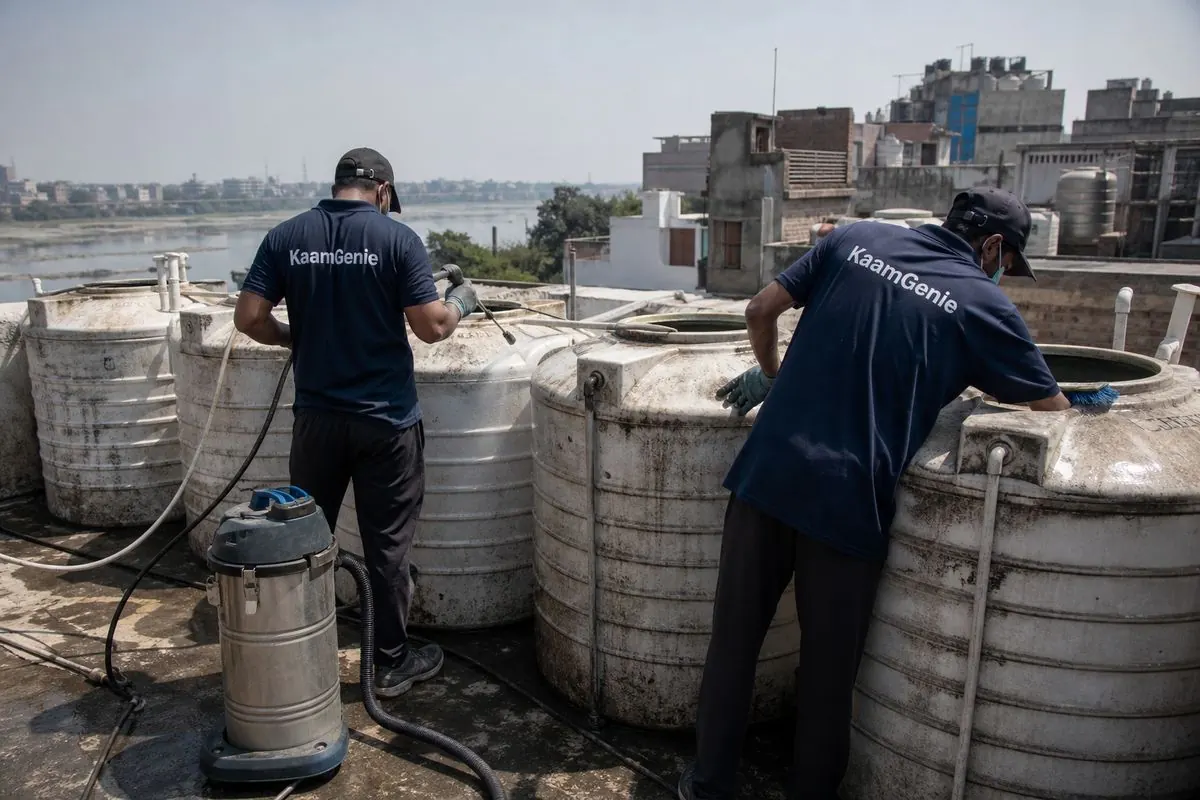 KaamGenie crew cleaning a society water tank in Ghonda, Delhi