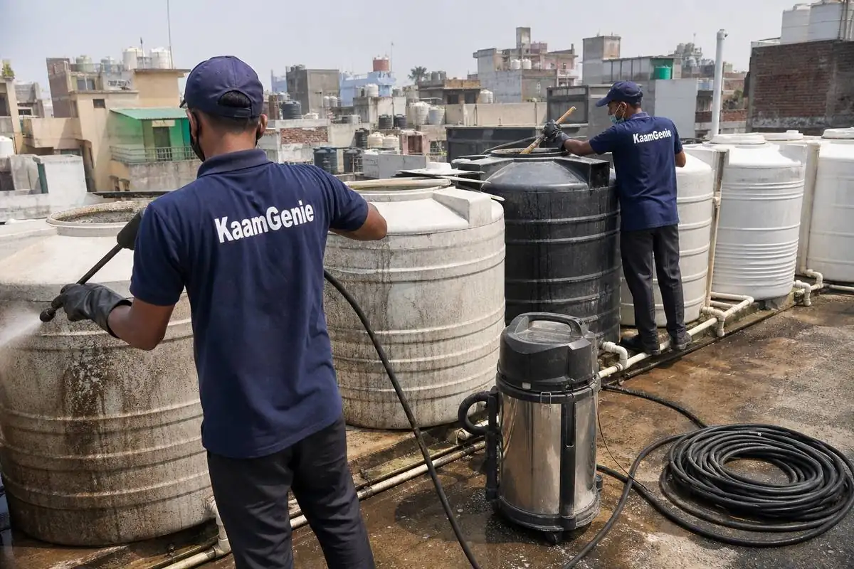 KaamGenie crew cleaning a society water tank in Hari Nagar Ashram, Delhi