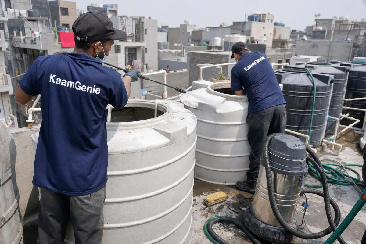 KaamGenie crew cleaning a society water tank in Jaitpur, Delhi