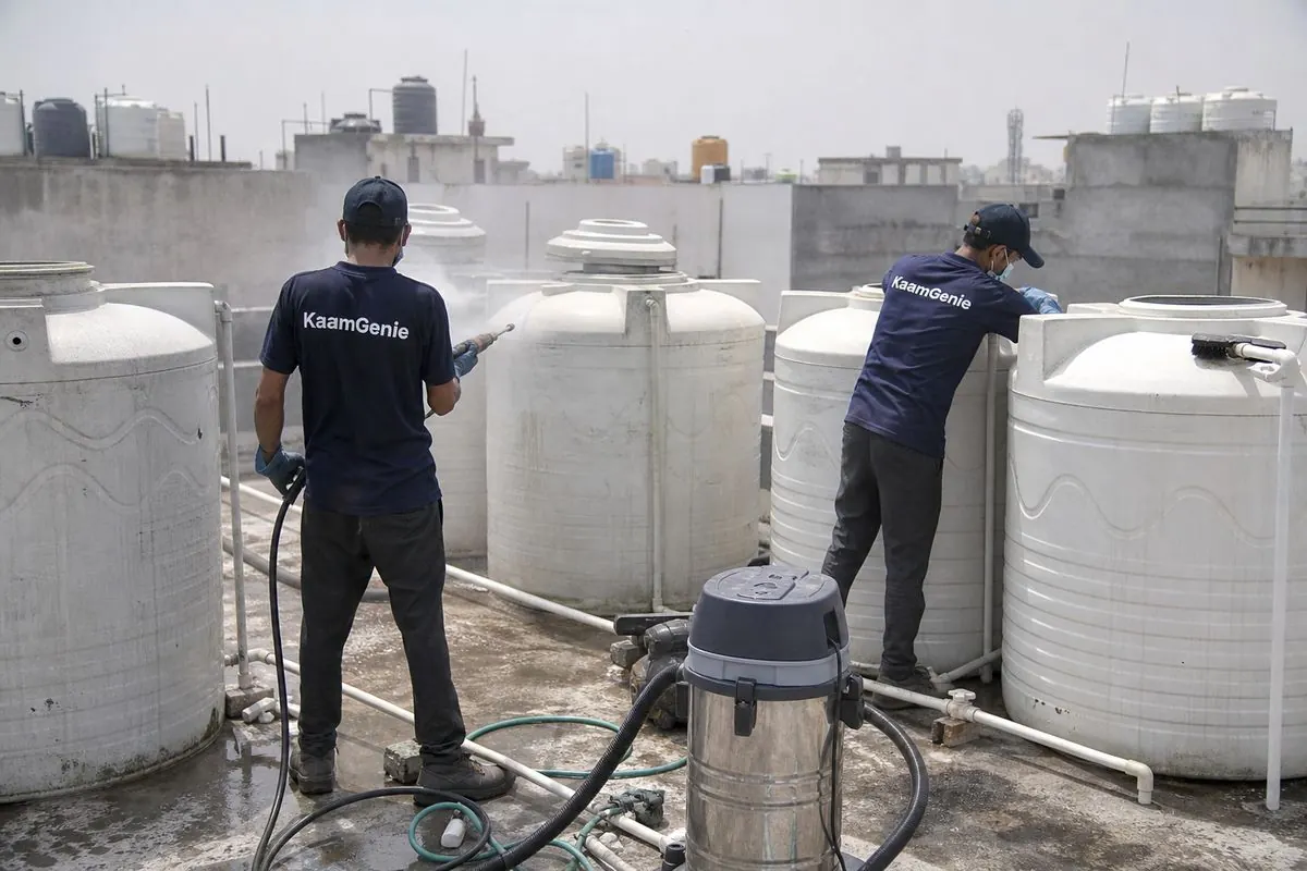 KaamGenie crew cleaning a society water tank in Jal Vihar, Delhi