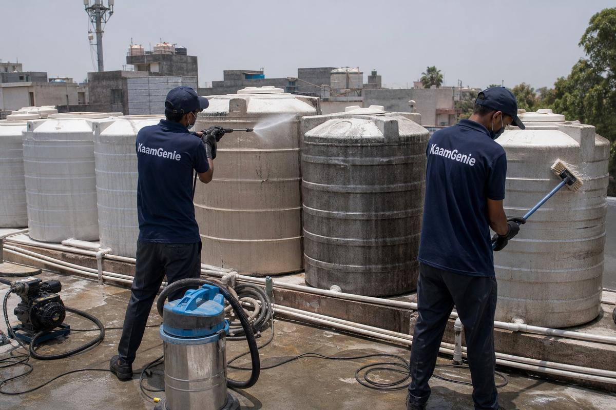 KaamGenie crew cleaning a society water tank in Janakpuri B Block, Delhi