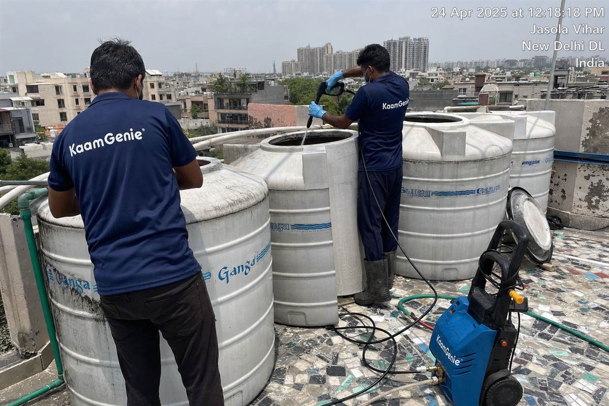 KaamGenie crew cleaning a society water tank in Jasola, Delhi