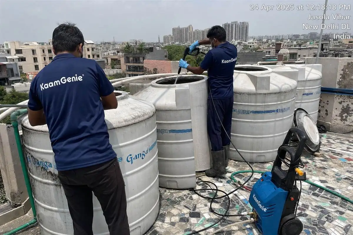 KaamGenie crew cleaning a society water tank in Jasola, Delhi