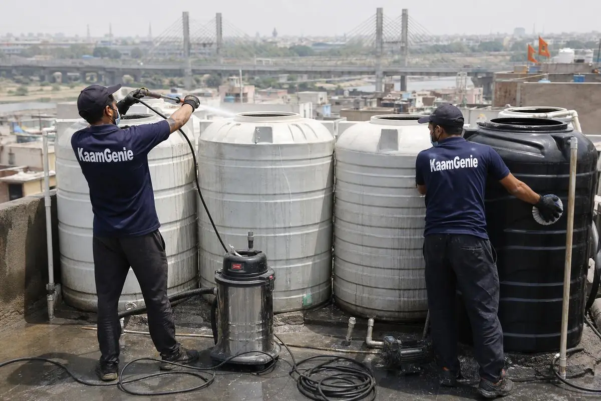 KaamGenie crew cleaning a society water tank in Kailash Nagar, Delhi