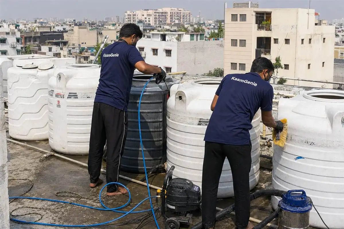 KaamGenie crew cleaning a society water tank in Kalkaji, Delhi