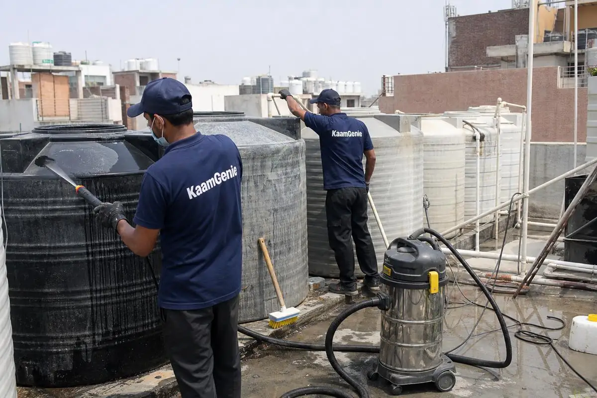 KaamGenie crew cleaning a society water tank in Karam Pura, Delhi