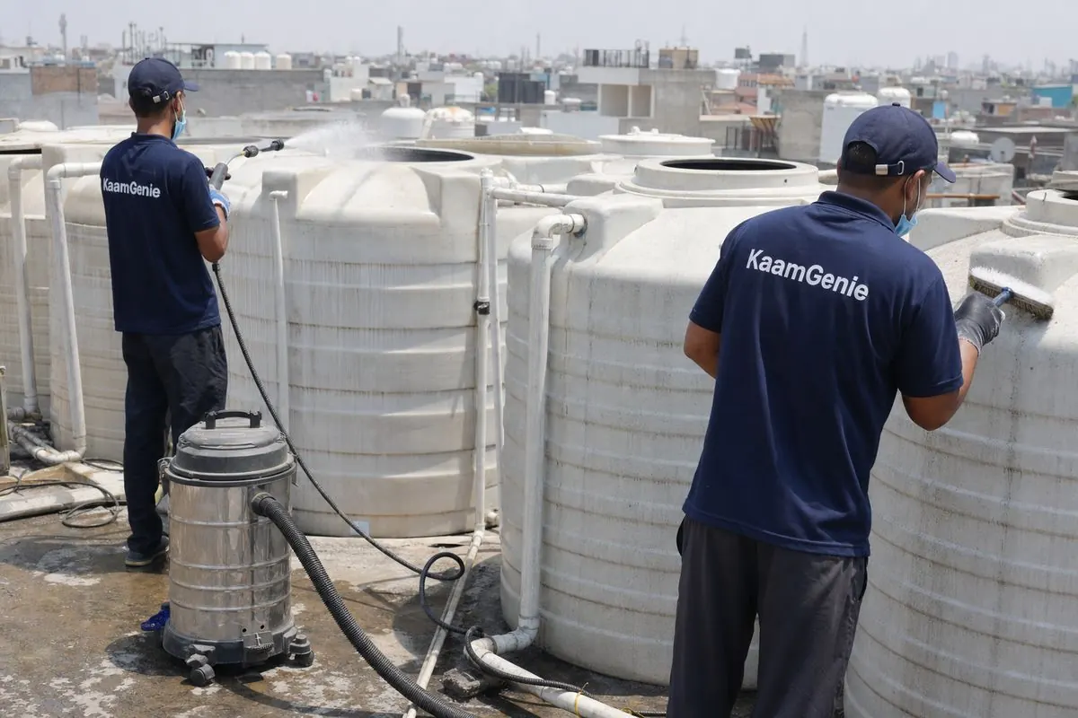 KaamGenie crew cleaning a society water tank in Khanpur, Delhi
