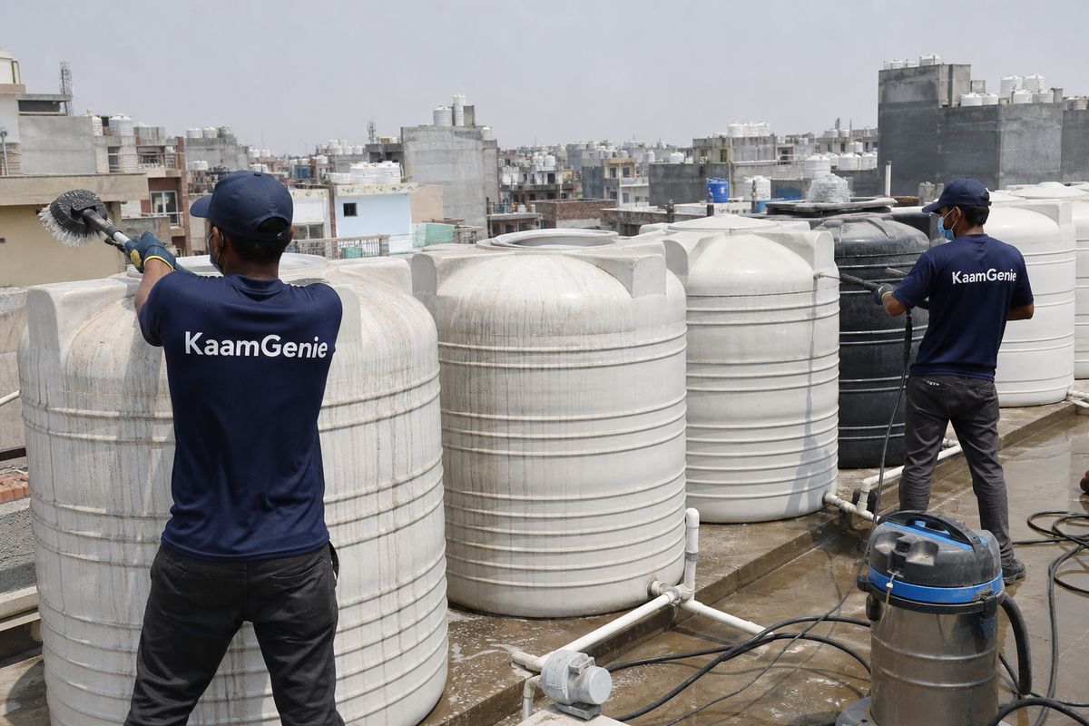 KaamGenie crew cleaning a society water tank in Khizrabad, Delhi
