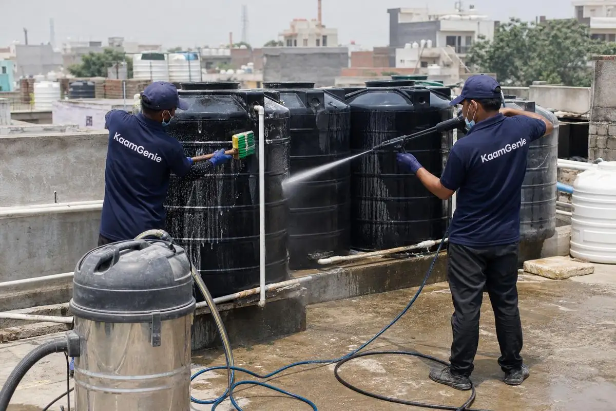 KaamGenie crew cleaning a society water tank in Kilokri, Delhi