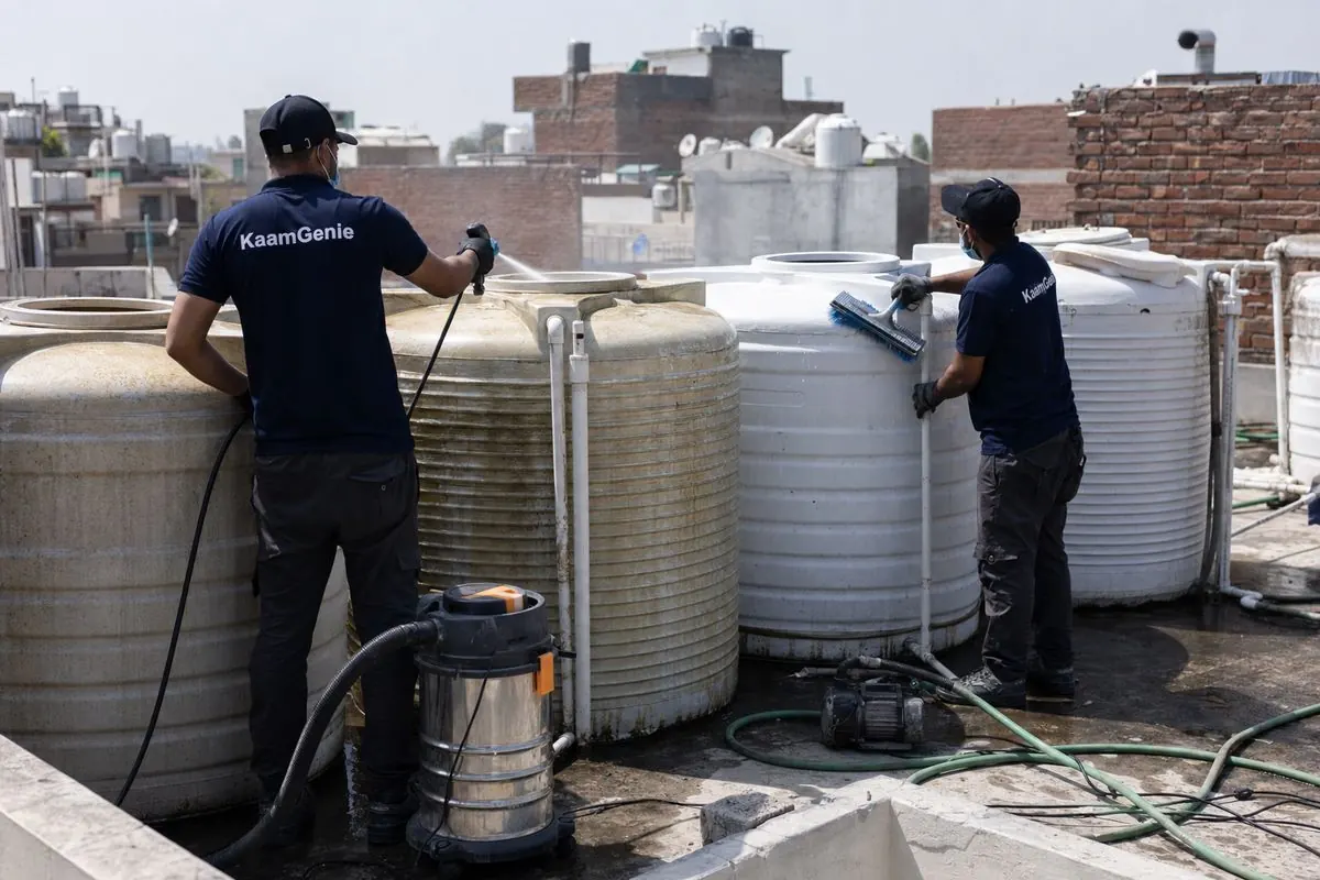 KaamGenie crew cleaning a society water tank in Kishangarh, Delhi