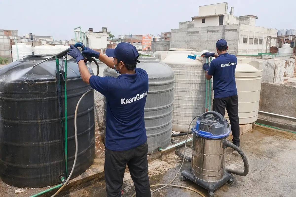 KaamGenie crew cleaning a society water tank in Krishna Nagar, Delhi