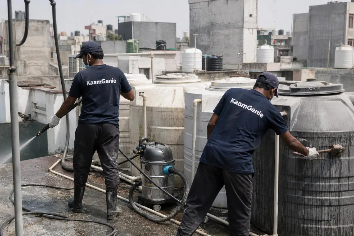 KaamGenie crew cleaning a society water tank in Lajpat Nagar 4, Delhi
