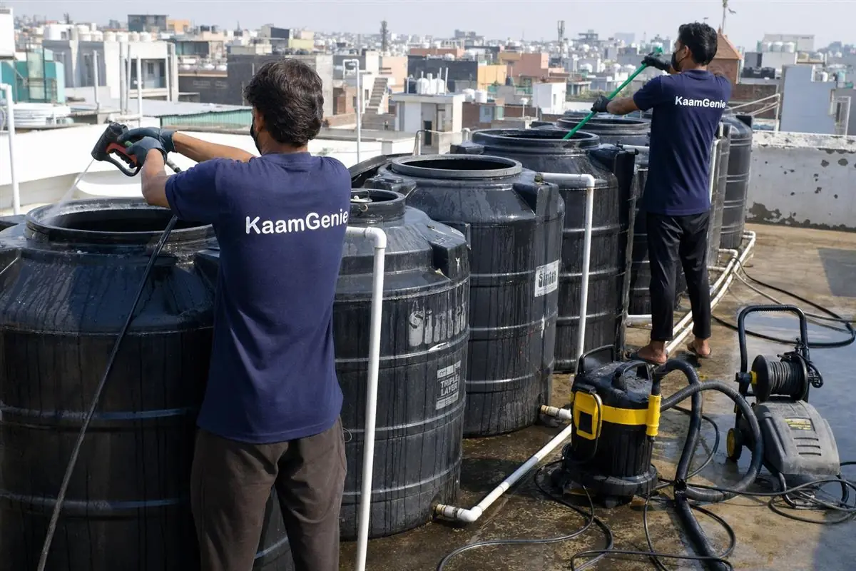 KaamGenie crew cleaning a society water tank in Lajpat Nagar, Delhi