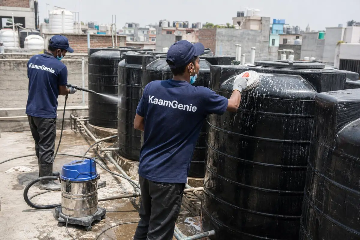 KaamGenie crew cleaning a society water tank in Laxmi Nagar Extension, Delhi