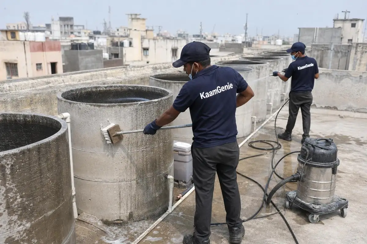 KaamGenie crew cleaning a society water tank in Lodhi Colony, Delhi