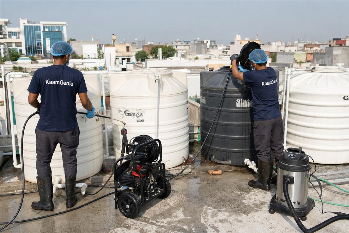 KaamGenie crew cleaning a society water tank in Malviya Nagar, Delhi