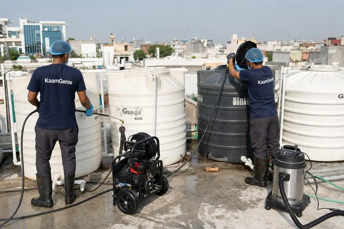 KaamGenie crew cleaning a society water tank in Malviya Nagar, Delhi