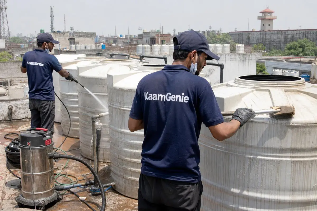 KaamGenie crew cleaning a society water tank in Mandoli Saboli, Delhi