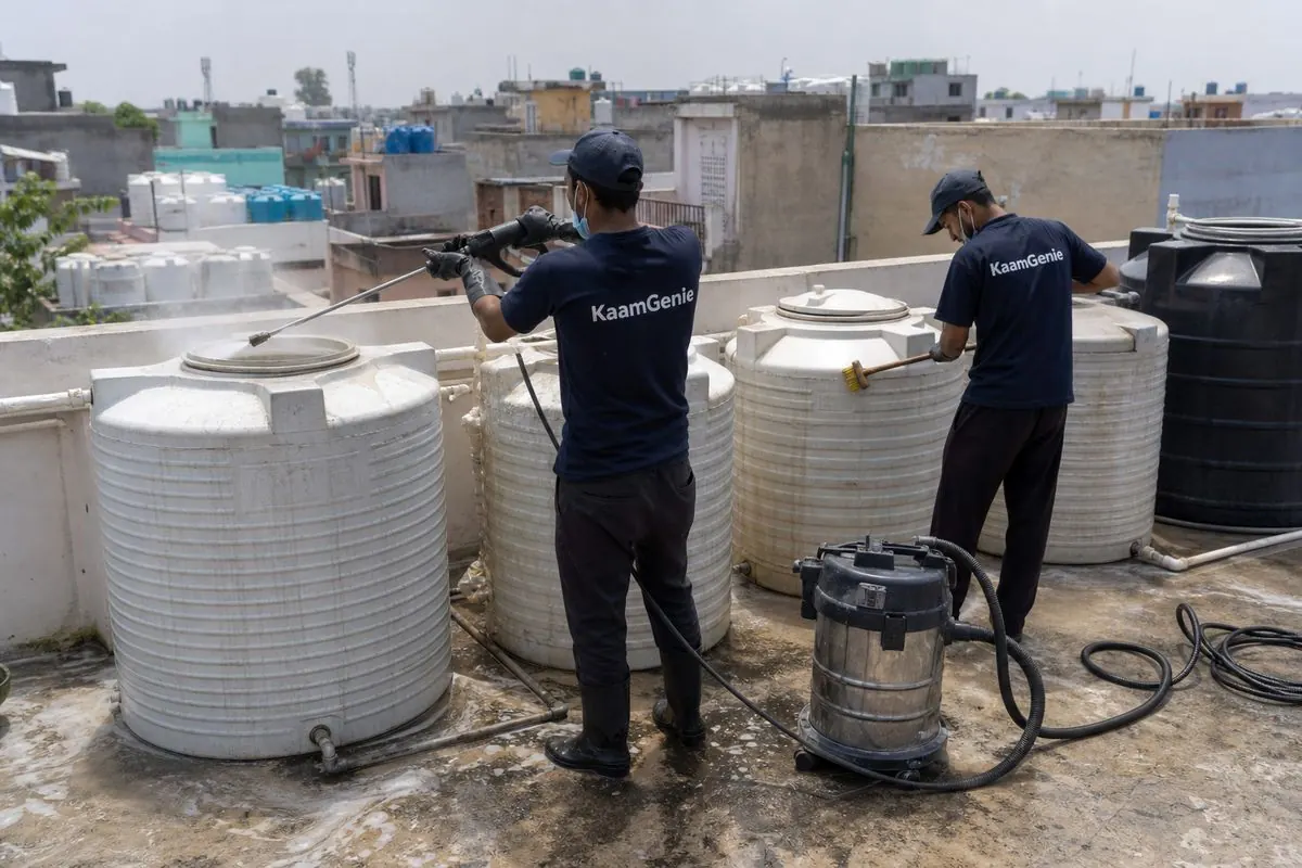 KaamGenie crew cleaning a society water tank in Matiala, Delhi